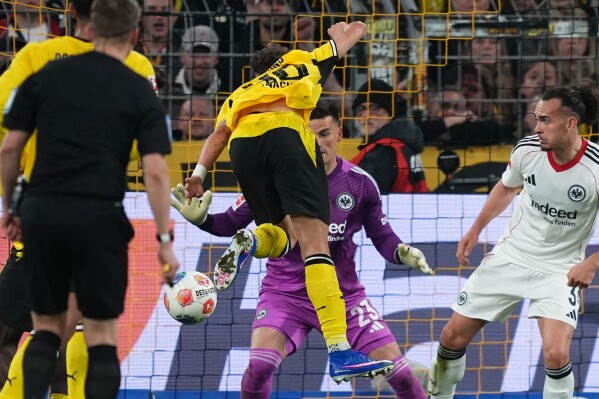 Dortmund edges 5-goal thriller to damage Frankfurt's European hopes