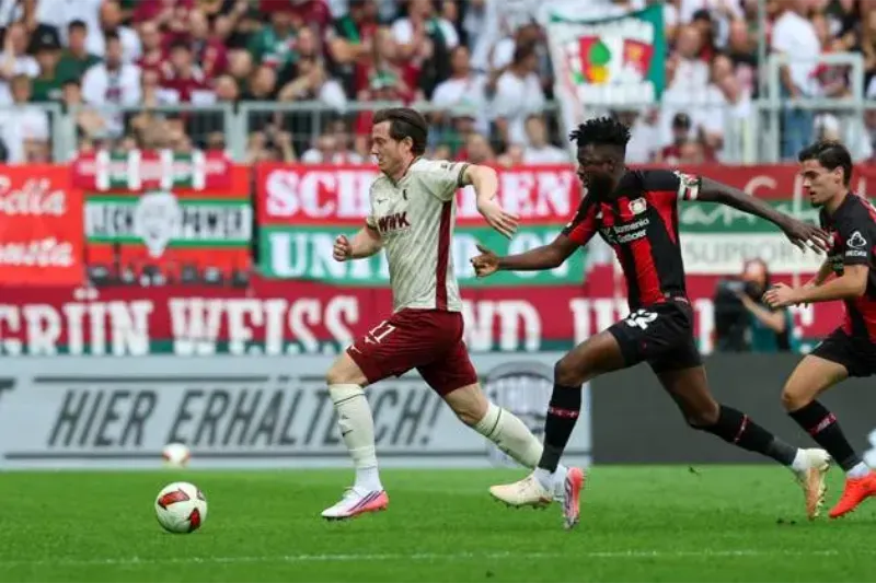 Augsburg denied historic third straight win by Schick’s late equaliser